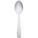 A Libbey stainless steel serving spoon with a white handle.