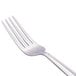 A Libbey stainless steel dinner fork with a silver handle.