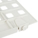 A close-up of a white plastic MetroMax i shelf divider with four holes.