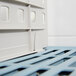 A MetroMax i blue plastic shelf divider.