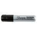 A close up of a black Sharpie Magnum permanent marker.
