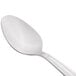 A Libbey stainless steel spoon with a white handle.