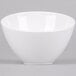 An American Metalcraft white melamine bowl on a gray surface.