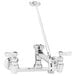 A Fisher wall mounted mop sink faucet with two lever handles and a sprayer.
