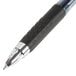 A Uni-Ball Signo 207 pen with a blue translucent barrel and blue ink.