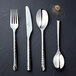 A close up of a silver Chef & Sommelier stainless steel dessert spoon.