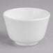 A white bowl on a gray surface.