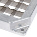 A metal mold with square holes.