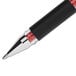 A close-up of a Uni-Ball 207 Impact pen with black and red ink and a silver tip.