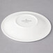 A white Villeroy & Boch porcelain saucer with a white rim and black text.