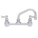 A silver Fisher wall mount faucet with two lever handles.