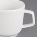 A close-up of a Villeroy & Boch white porcelain coffee cup with a handle.