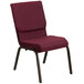 A burgundy Flash Furniture church chair with a gold metal frame.