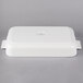 A white rectangular Villeroy & Boch porcelain baking dish with handles.