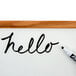 The word "hello" written on a white board using a black Expo chisel tip marker.