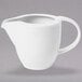 A Villeroy & Boch white porcelain creamer with a handle.