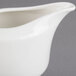 A Villeroy & Boch white porcelain creamer with a handle.