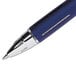 The tip of a Uni-Ball Jetstream RT black pen with a blue barrel.