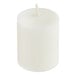 A white Sterno candle in a clear plastic case.