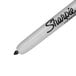A white Sharpie permanent marker with black writing.