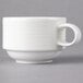 A close-up of a Villeroy & Boch white porcelain cup with a handle.