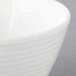 A close up of a Villeroy & Boch white porcelain bowl with a white rim.