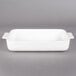 A white rectangular Villeroy & Boch baking dish with handles.