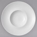 A white porcelain bowl with a white rim.