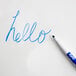 A blue Expo fine point marker writing "hello" on a white board.