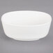 A white Villeroy & Boch oval bowl on a gray surface.