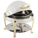 A Bon Chef stainless steel chafer with brass accents and Roman legs.