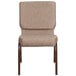 A beige Flash Furniture church chair with metal legs.