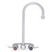 A silver Fisher wall mount faucet with lever handles.