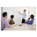 A woman using Expo dry erase markers to write on a whiteboard in a corporate office cafeteria.