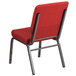 A red Flash Furniture church chair with metal legs.