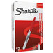 A white box with red text reading "Sharpie Permanent Marker" with a red Sharpie marker inside.