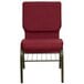 A Flash Furniture burgundy church chair with metal legs.