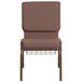 A Flash Furniture church chair with a gold metal frame and brown fabric with white dots and a wire book rack.