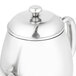 A Vollrath stainless steel teapot with a lid.