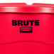 A red Rubbermaid Brute trash can with a lid.
