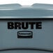 A Rubbermaid Brute 20 gallon round gray trash can with a black lid and logo.