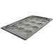 A Vollrath SteelCoat x3 Egg Poacher tray with 12 cups.