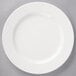 A white Villeroy & Boch porcelain plate with a circular diamond pattern.
