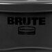 A black Rubbermaid BRUTE round trash can on a counter.