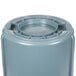 A grey Rubbermaid BRUTE 44 gallon round plastic container with a lid.