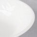 A close up of a Villeroy & Boch white porcelain bowl with a white rim.