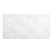 A white rectangular Glassine pad with gold floral pattern.