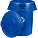 A blue plastic Rubbermaid BRUTE recycling can with a lid.