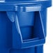 A blue plastic Rubbermaid BRUTE recycling can with a lid.