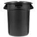 A black Rubbermaid BRUTE round plastic trash can with lid.